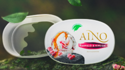 Container for Aino ice cream against a woodland backdrop
